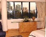 Grange 80's curved windows in master bedroom. 10th floor with green tree views.