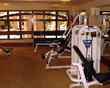 Central Square's gym is bright and has pool views.